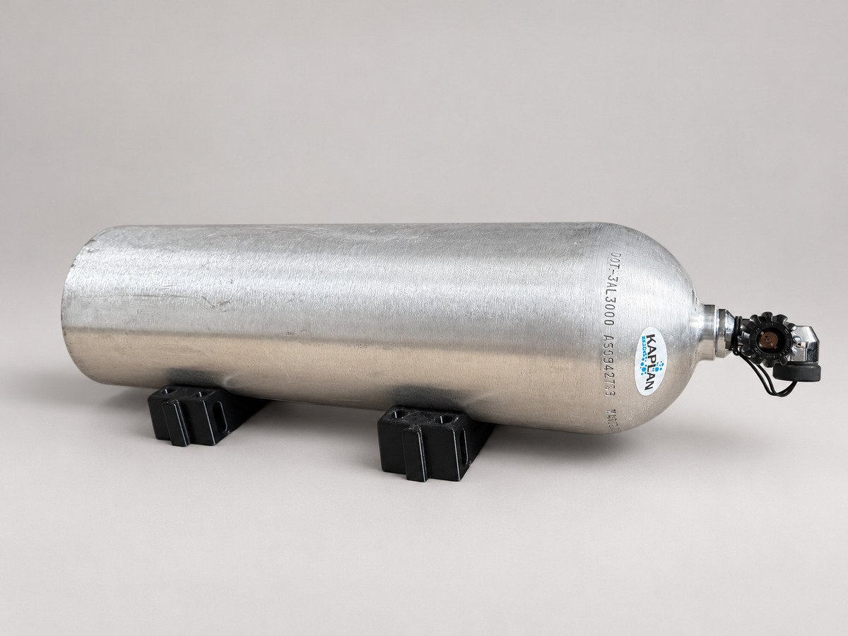 One aluminum scuba cylinder resting horizontally on two black ABS cradle pieces, one at each support point. One two-piece set is shown in use; the tank is not included.