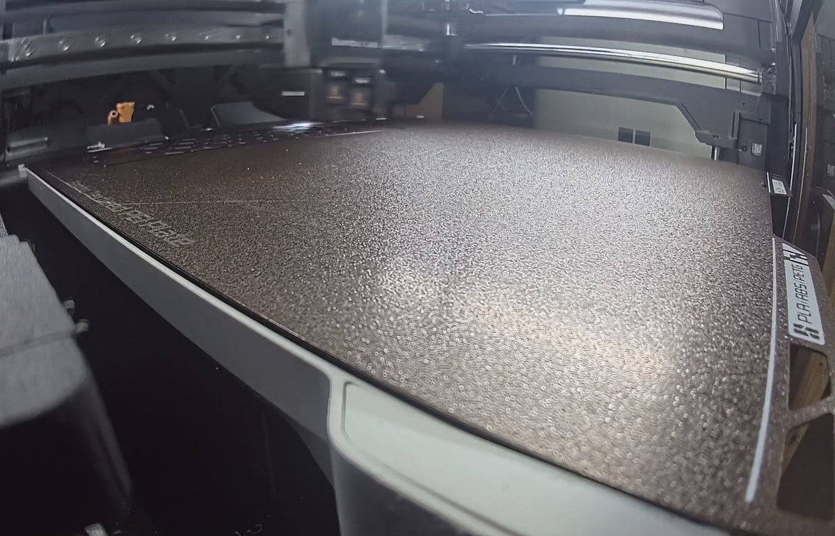 Manufacturing timelapse of black ABS tank cradle pieces being 3D printed in our shop.